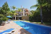 Elegant south facing four bedroom villa in small gated community of only nine villas set at the front of the golf course of Rio Real, Marbella